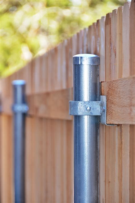 installing metal posts next to house|placement of fencepost near house.